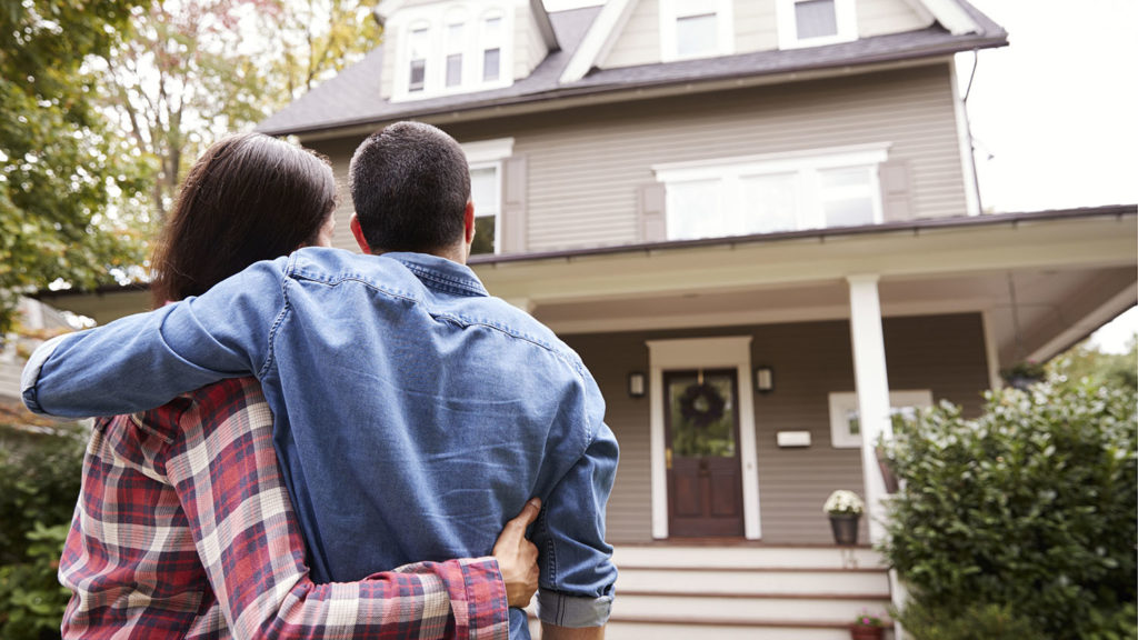 Happy family with their new home